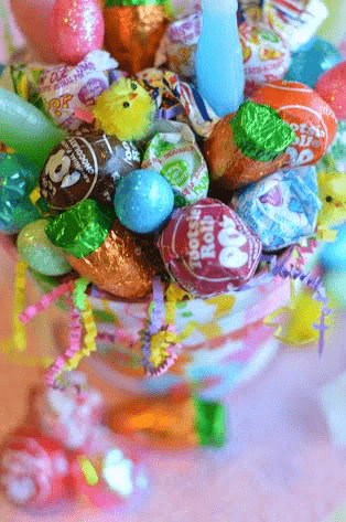 Sucker bouquets are an easy DIY and simple gift. Learn how to make a lollipop pop centerpiece with any type of sucker or dum dums for your next party, baby shower, birthday or a school carnival. This is an inexpensive DIY!