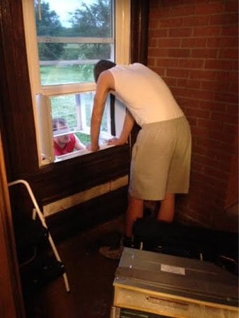 T and Paul installing the Haier AC unit